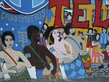 Cantan y bailan candombe en las calles, y en las paredes de Buenos Aires
